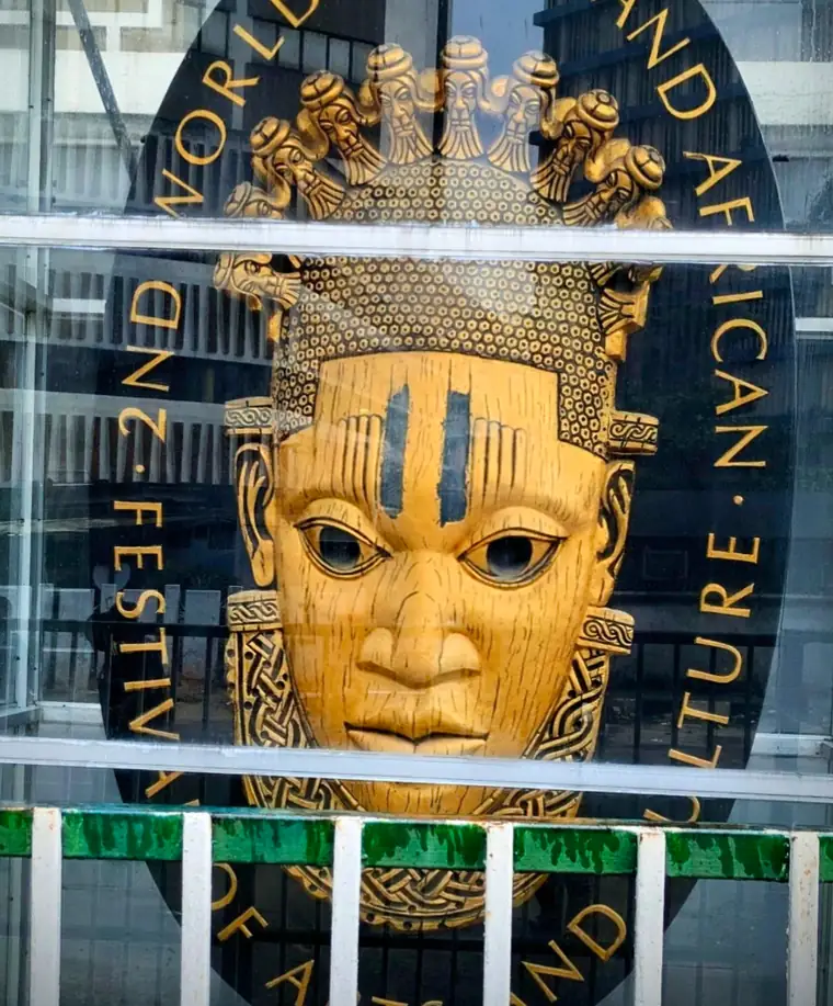 The FESTAC ’77 emblem: an ivory mask of Queen Idia, crowned with small carved heads.