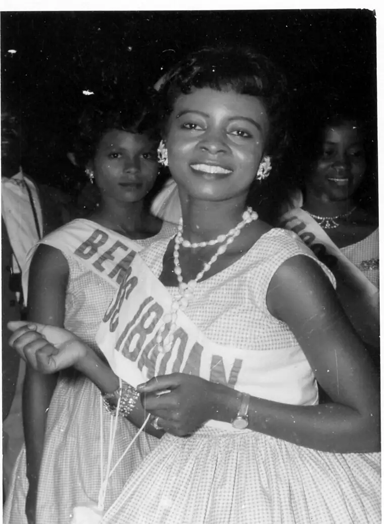 Black and white photograph of Rosemary Anieze in an evening gown at a ball in 1960.